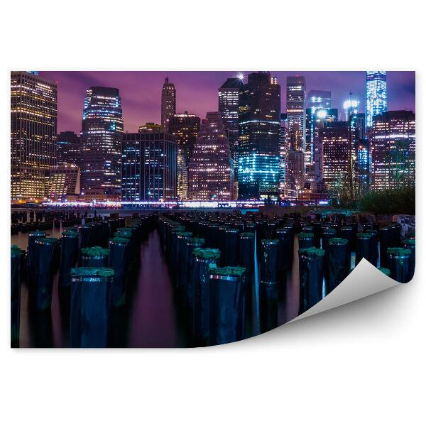 Papier peint Gratte-ciel Troncs Eau Nuit Lumières