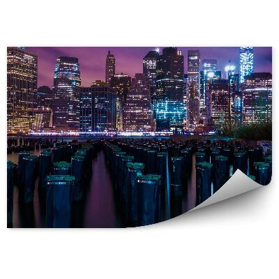 Papier peint Gratte-ciel Troncs Eau Nuit Lumières