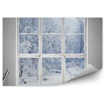 Papier peint Fenêtre donnant sur une forêt enneigée
