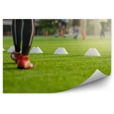 Papier peint Action sur un terrain de football