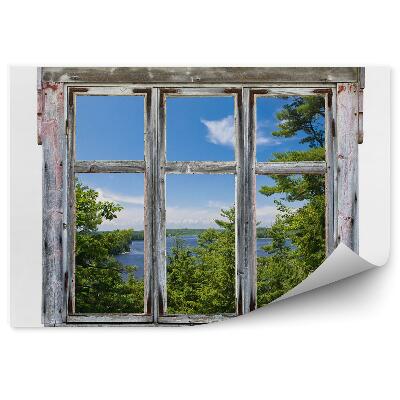Papier peint Vue pittoresque à travers le cadre d'une vieille fenêtre