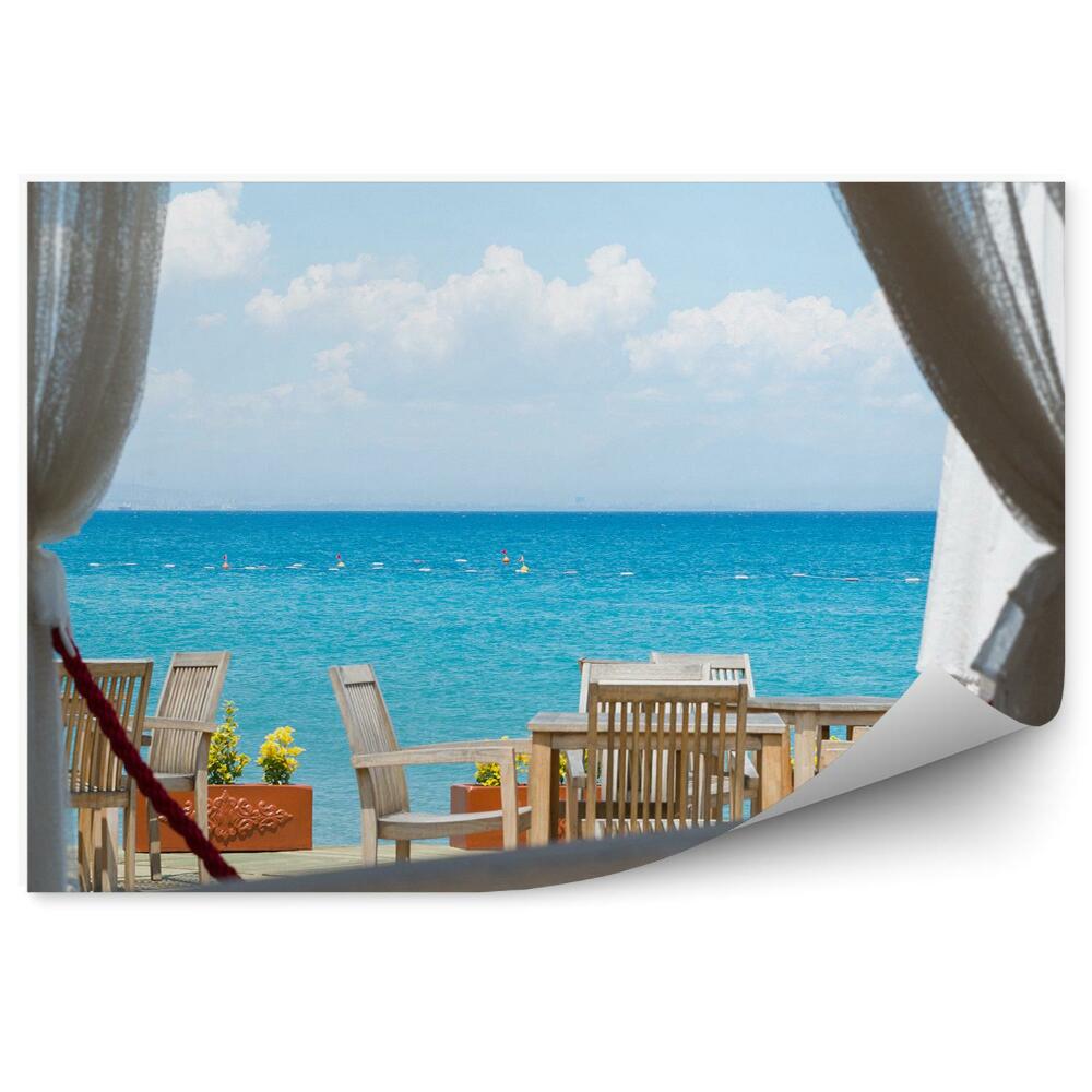 Papier peint Vue sur la mer depuis la fenêtre d'un café Bleu