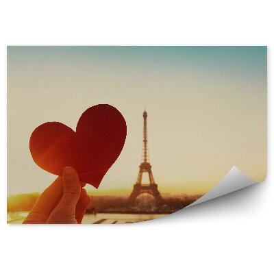 Papier peint Cœur d'amour découpé dans du papier sur fond de tour Eiffel