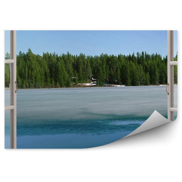 Papier peint Fenêtre ouverte et vue sur un lac gelé et une forêt