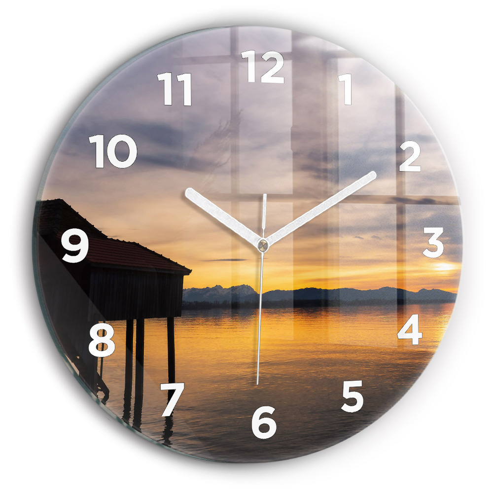 Horloge ronde Coucher de soleil sur un lac