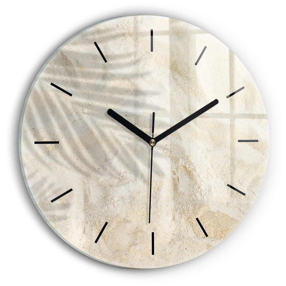 Ombre d'un palmier sur le sable Horloge ronde en verre