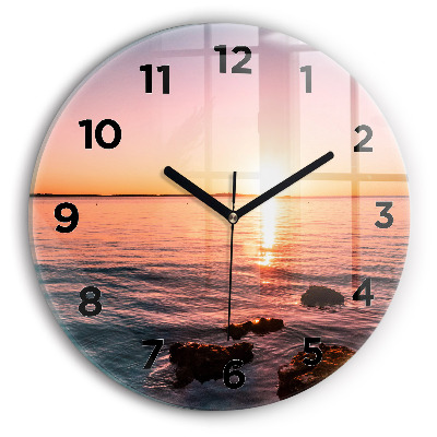 Horloge ronde en verre Rochers au coucher du soleil